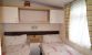 2nd Twin bedroom with 3/4 length wardrobe, drawers, overbed cupboards and vanity mirror