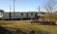 Another picture of static caravan with enclosed garden from another angle.